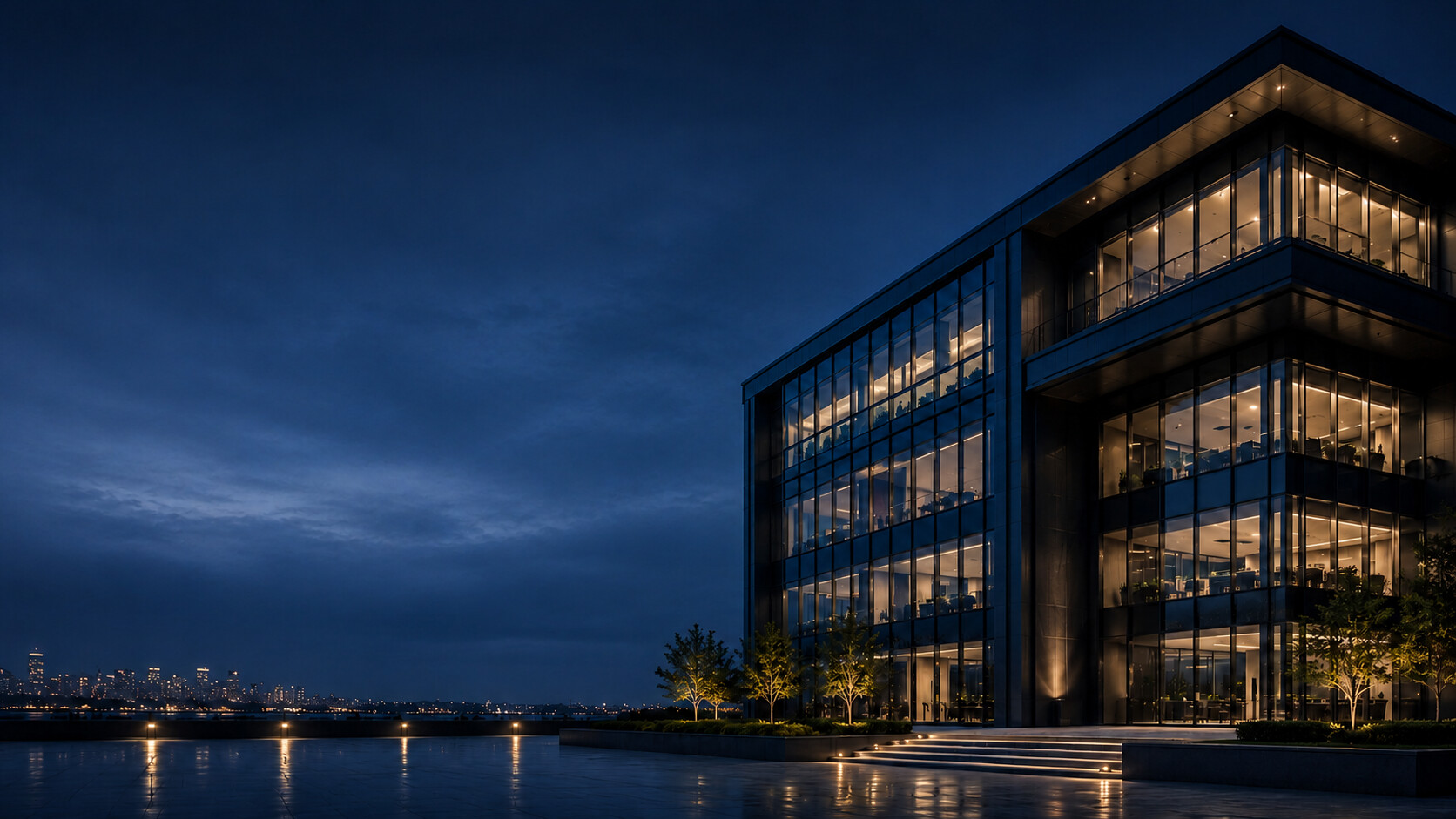Modern corporate office building at twilight with illuminated interiors